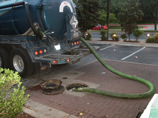 Pump truck cleaning out a grease trap
