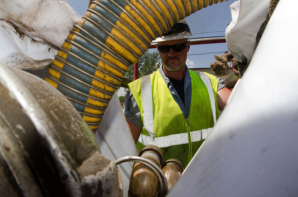 Worker repairing sewer lines