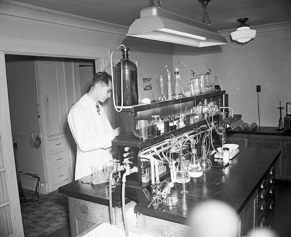 Historic photo of water testing in Seattle municipal lab