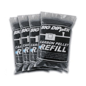 Four clear plastic bags labeled "Big Dipper Carbon Pellet Refill" stand upright, each filled with small black pellets. Designed for self-cleaning grease trap systems, instructions are printed on the front of each bag.