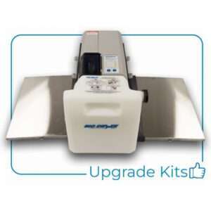 A gray and white industrial device with two metal side panels and a large white container labeled "Big Dipper" showcases the Upgrade Kit for 22.5” Big Dipper; features automatic grease removal. Blue text at bottom right reads "Upgrade Kits" with a thumbs-up icon.