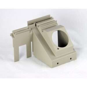 A beige, angular plastic or metal component with a large circular opening, flat surfaces, and several smaller holes—ideal as part of an automatic oil and grease separator—rests on a plain white background.