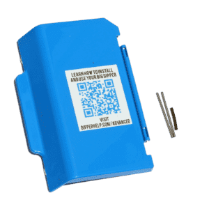 A blue plastic case with a QR code label on top, next to three small metal rods. The label provides instructions to visit a website for installing and using the automatic oil and grease separator.